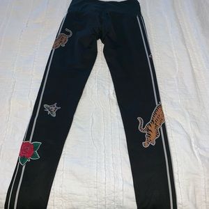 Noli leggings size S tiger and moth on black